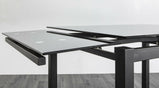 Mesa de comedor extensible de vidrio templado negro de 7 estrellas con 4 sillas de cuero sintético